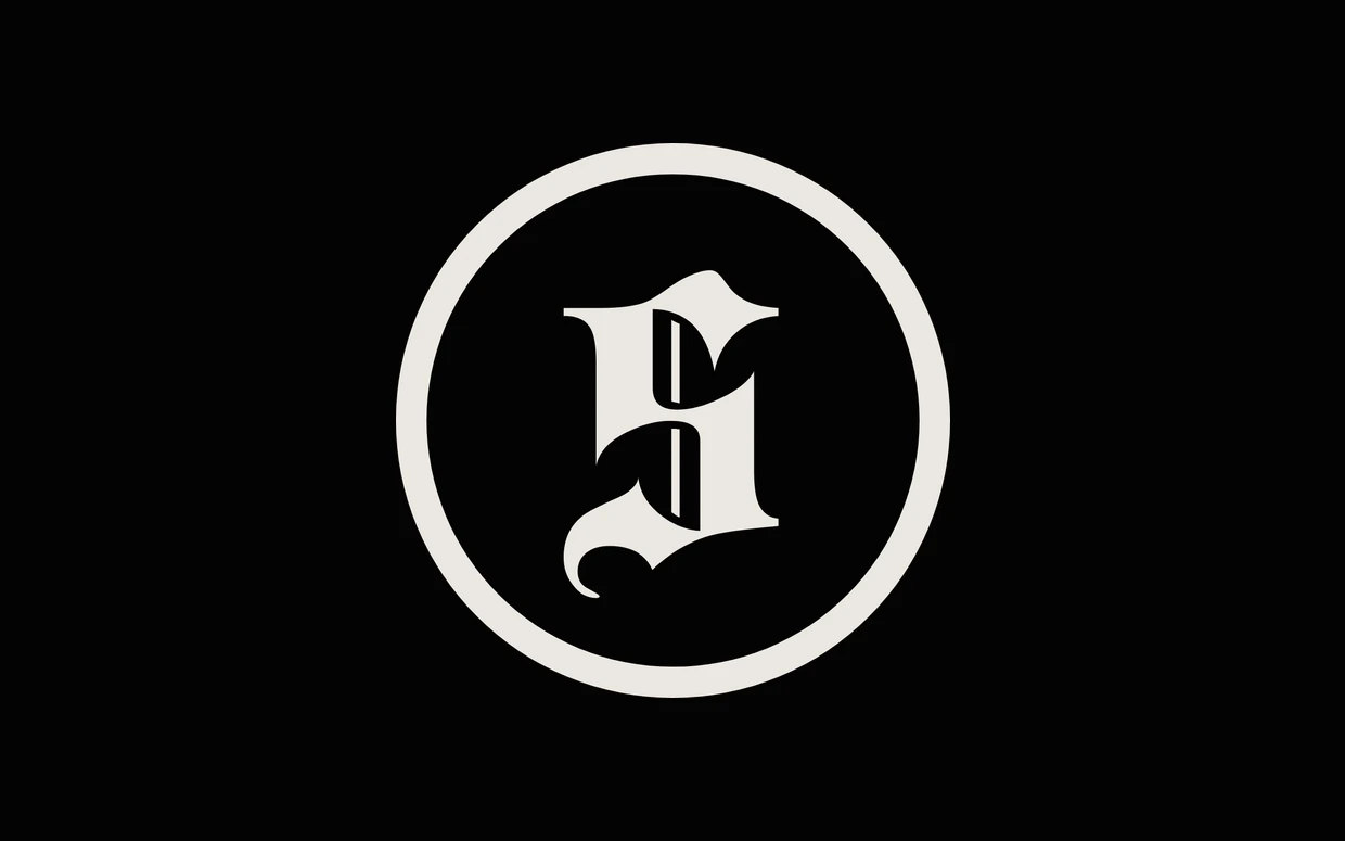 The Scriare logo: a blackletter S in cream on a black disc